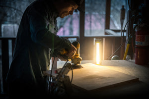 Goal Zero rechargeable flashlight lighting up a worker's station